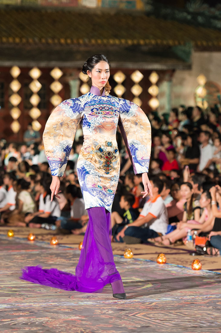 Model wearing a  Vietnamese dress during the Oriental Night at Hue Festival 2014, Thua ThienâHue Province, Viet Nam, Indochina, South East Asia.