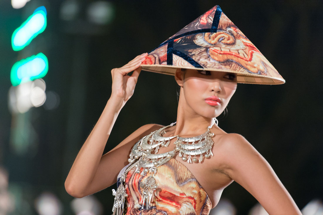 Model wearing a  Vietnamese dress during the Oriental Night at Hue Festival 2014, Thua ThienâHue Province, Viet Nam, Indochina, South East Asia.