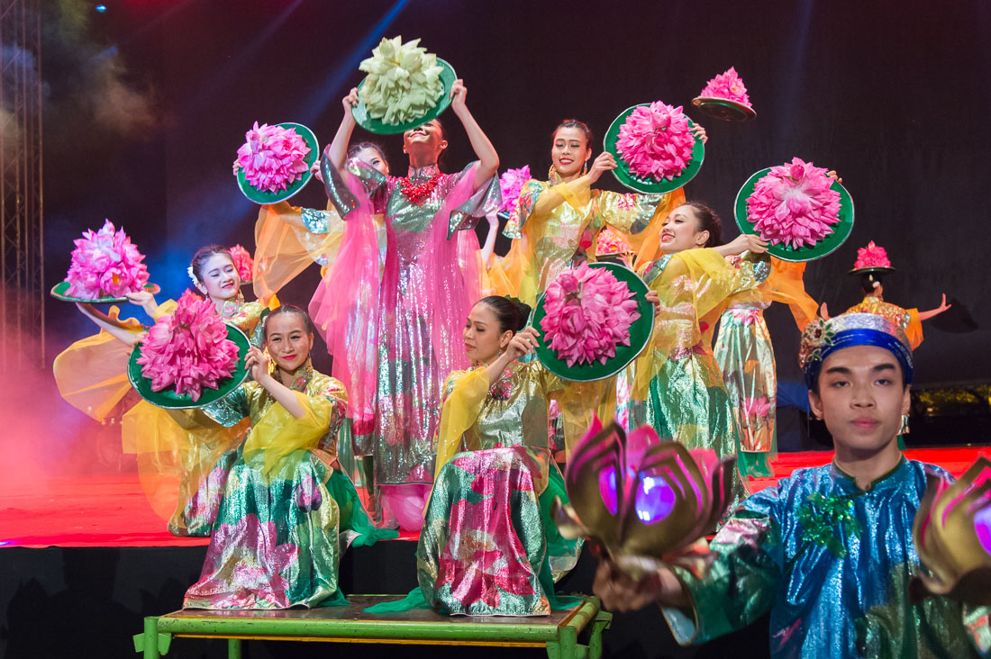 Vietnamese artists wearing the traditional dress, the ao dai, performing at Hue Festival 2014, Thua ThienâHue Province, Viet Nam, Indochina, South East Asia.