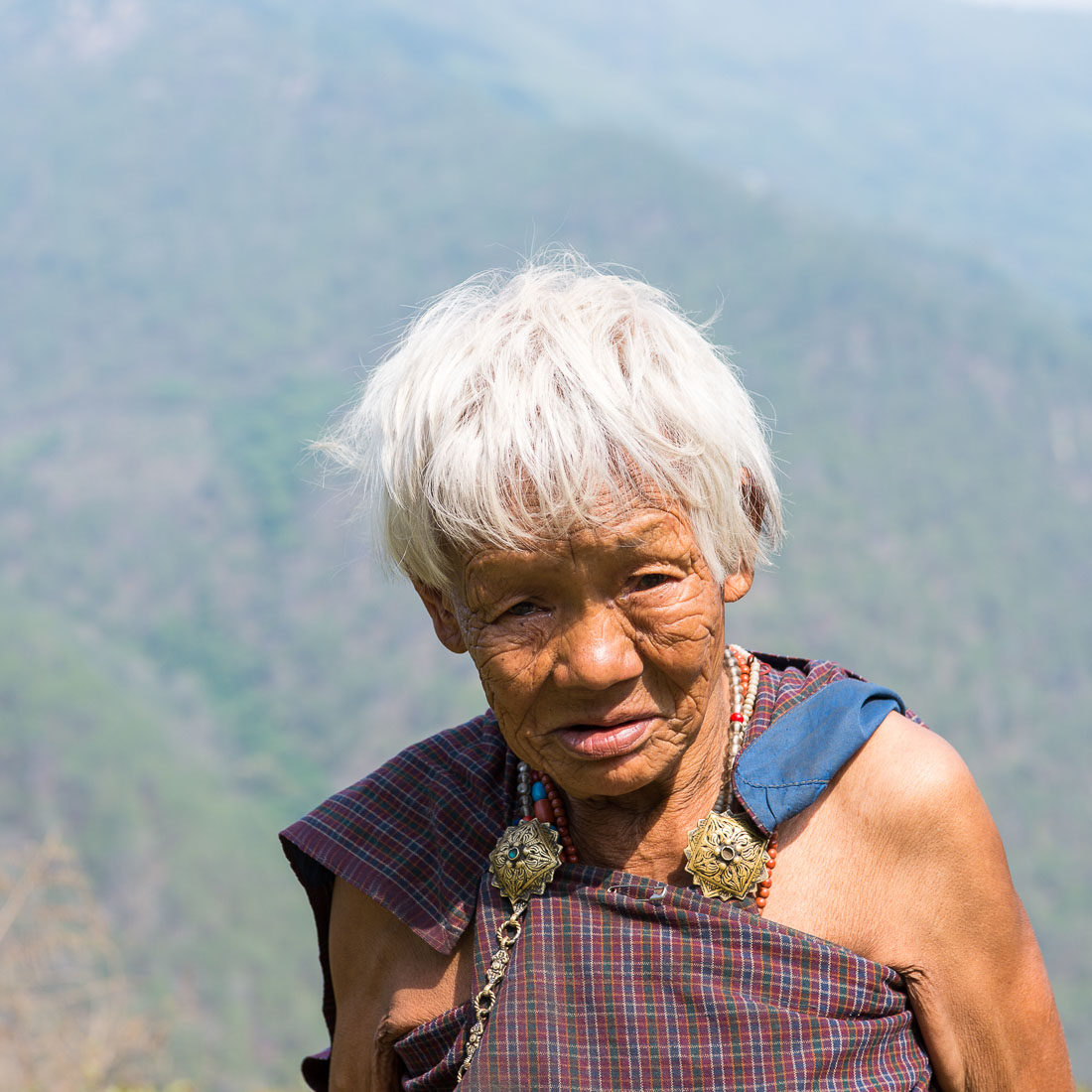 Old woman in the countryside, Kingdom of Bhutan, Asia