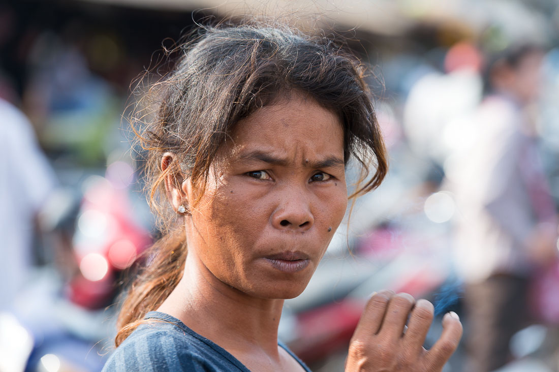 Smoking woman at the Stung Treng market, Stung Treng province. Kingdom of Cambodia, Indochina, South East Asia