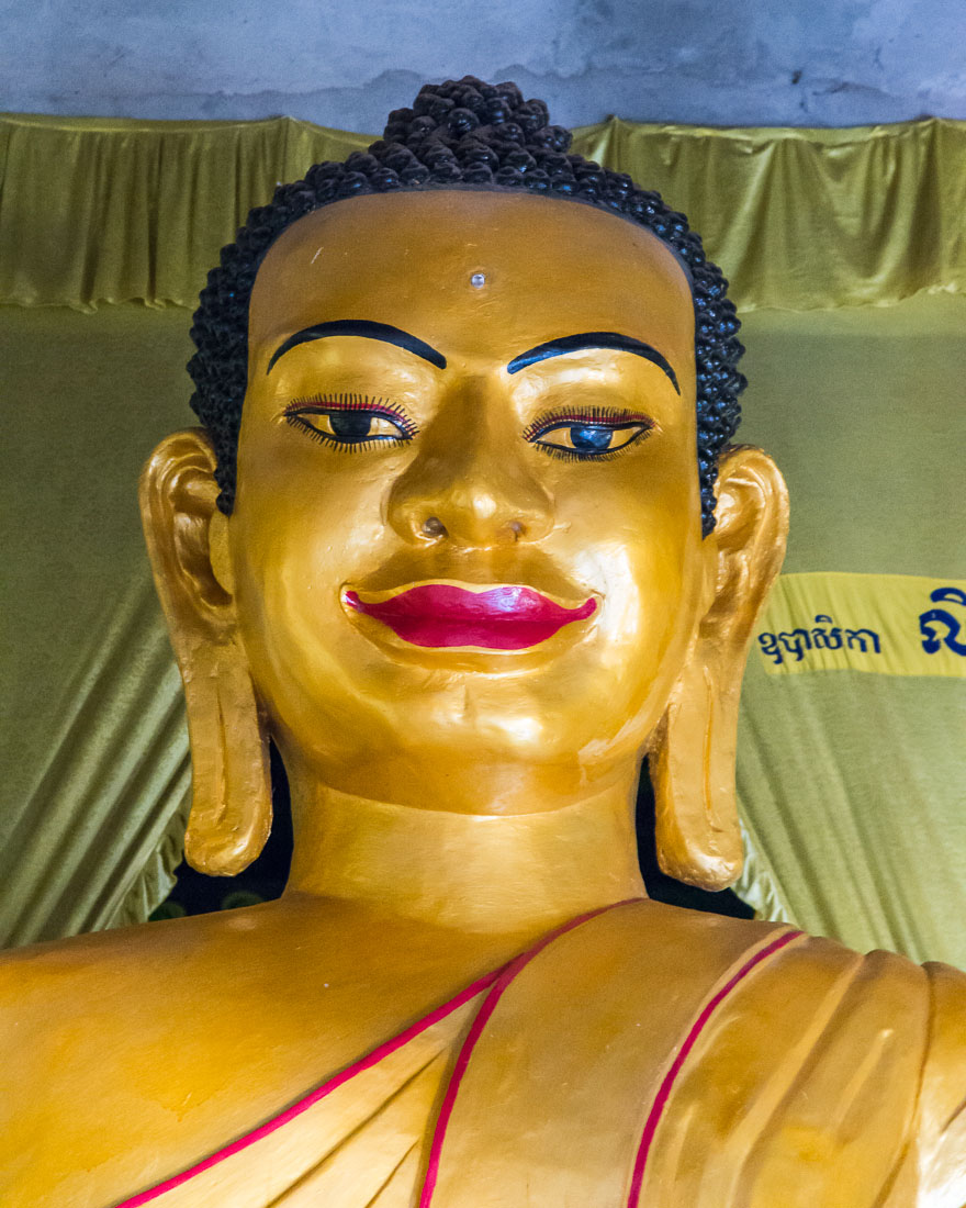 Face from a large Buddha statue in the Wat Leo in Siem Reap. Kingdom of Cambodia, Indochina, South East Asia.