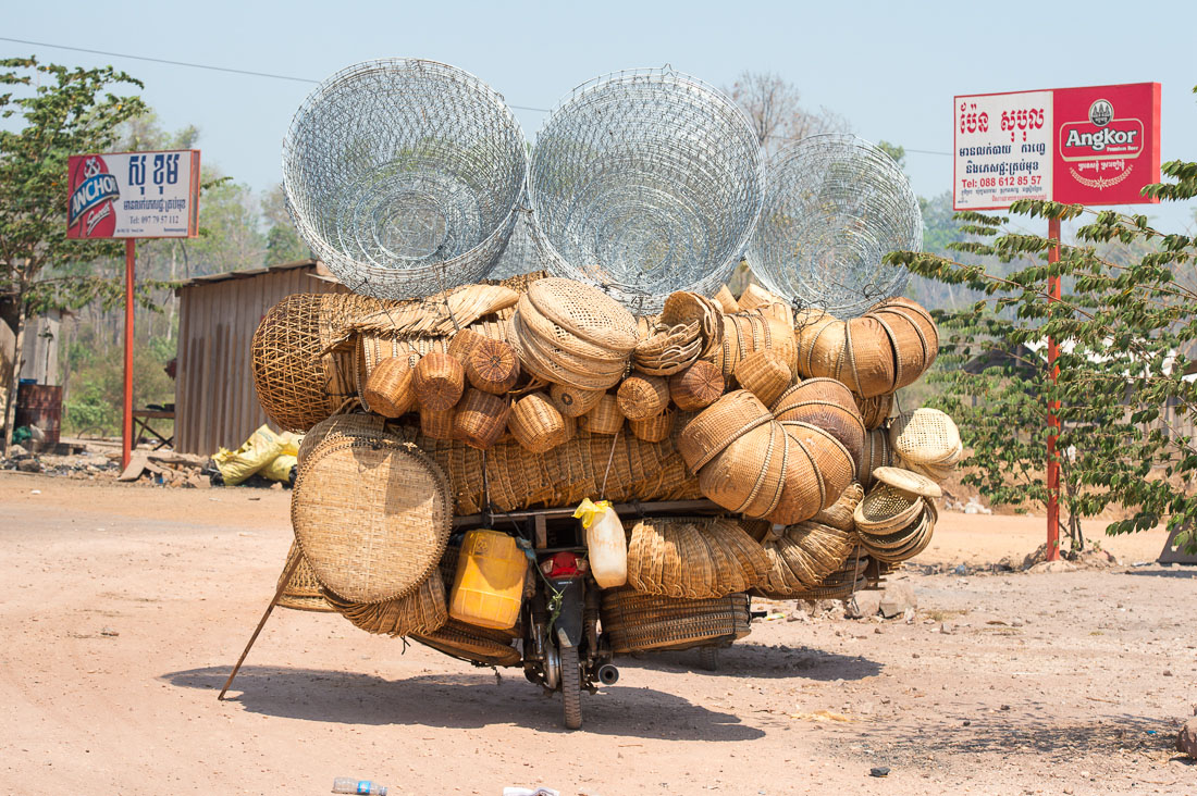 A scooter fully loaded with bamboo baskets. Kingdom of Cambodia, Indochina, South East Asia.