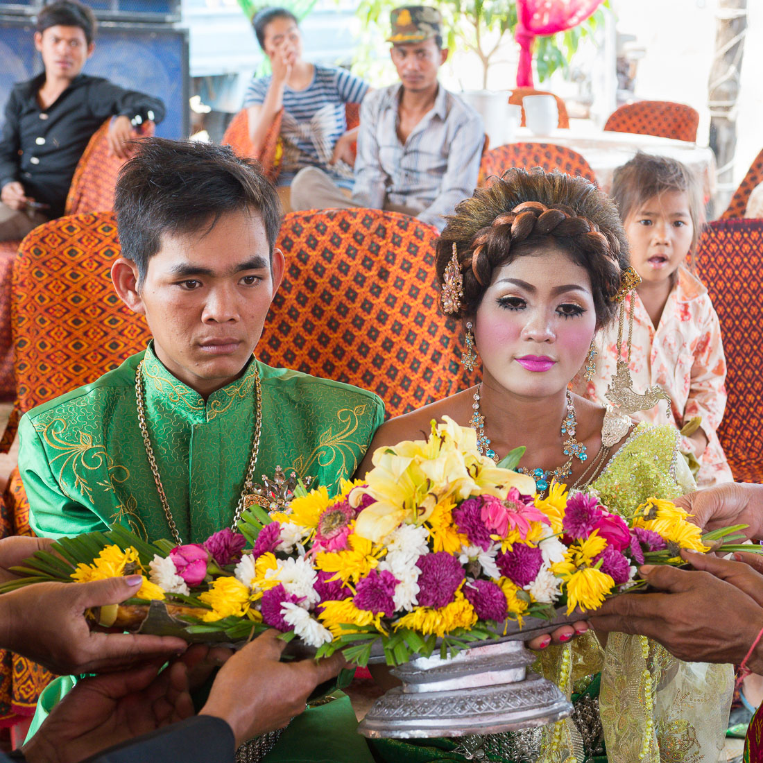 The groom and the bride at their wedding cerimony in rural Cambodia, wearing the traditional costume. Kingdom of Cambodia, Indochina, South East Asia