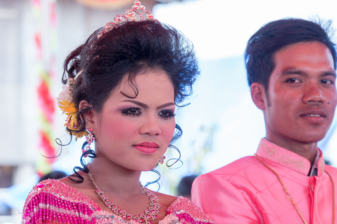 The groom and the bride at their wedding cerimony in rural Cambodia, wearing the traditional costume. Kingdom of Cambodia, Indochina, South East Asia