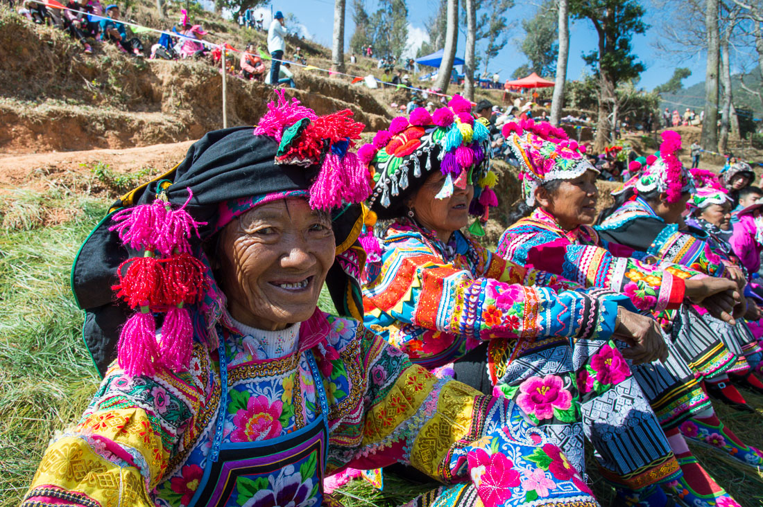 Colorful costumes of the Yi ethnic minority people, at the annual festival in Zhi Ju village. Yong Ren County, Yunnan Province, China, Asia. Nikon D4, 24-120mm, f/4.0, VR