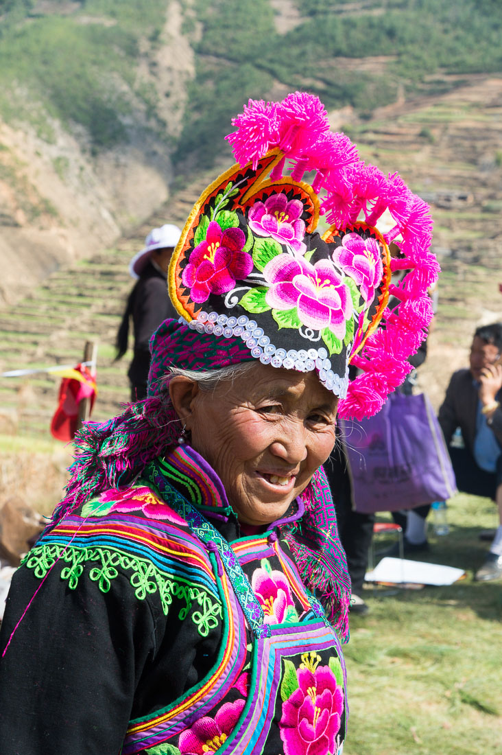 Colorful costume of the Yi ethnic minority people, at the annual festival in Zhi Ju village. Yong Ren County, Yunnan Province, China, Asia. Nikon D4, 24-120mm, f/4.0, VR