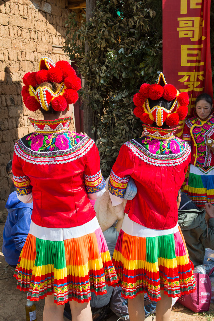 Colorful costumes of the Yi ethnic minority people, at the annual festival in Zhi Ju village. Yong Ren County, Yunnan Province, China, Asia. Nikon D4, 24-120mm, f/4.0, VR