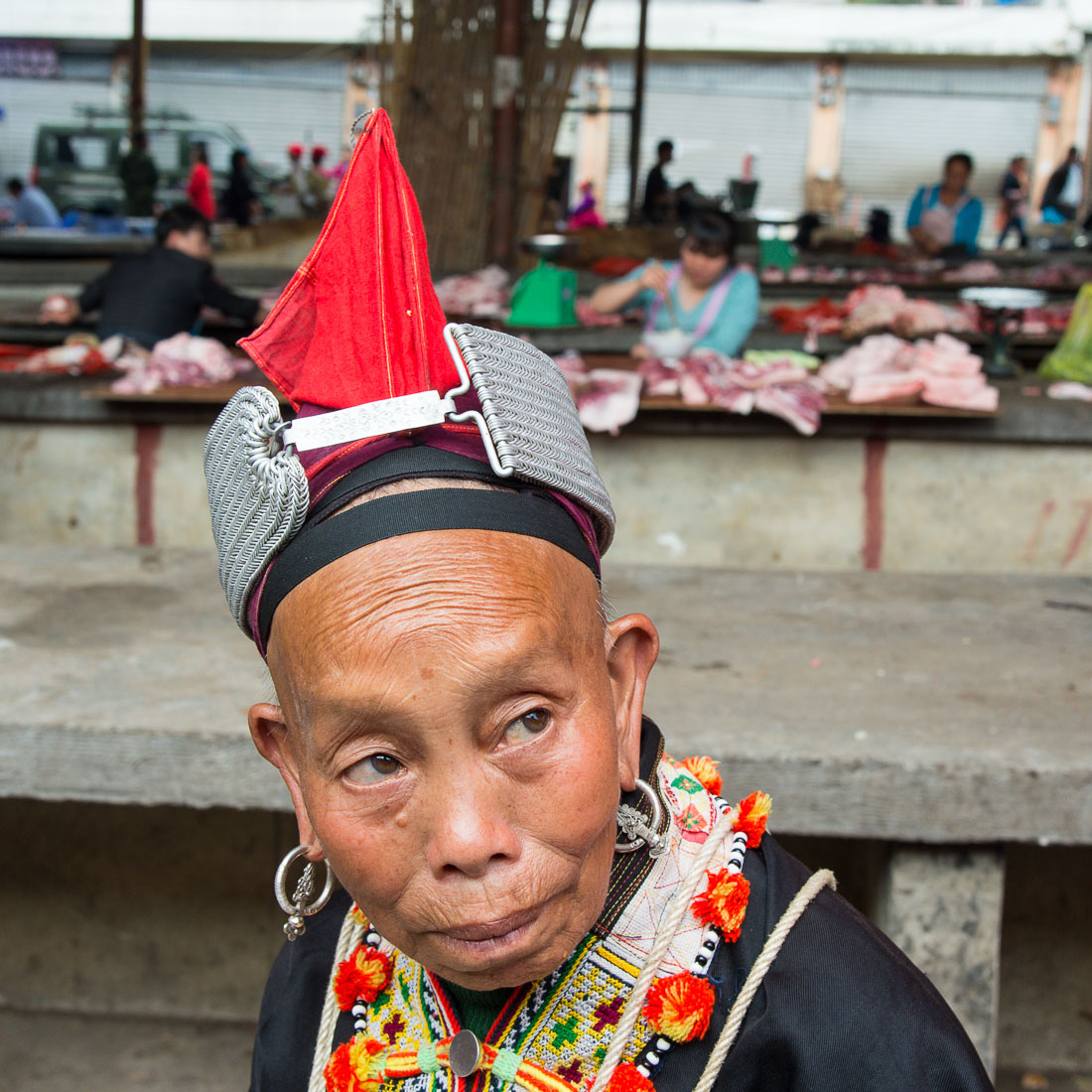 A woman from the Yao ethnic minority people wearing the traditional costume. Jin Ping market, Yunnan Province, China, Asia. Nikon D4, 24-120mm, f/4.0, VR