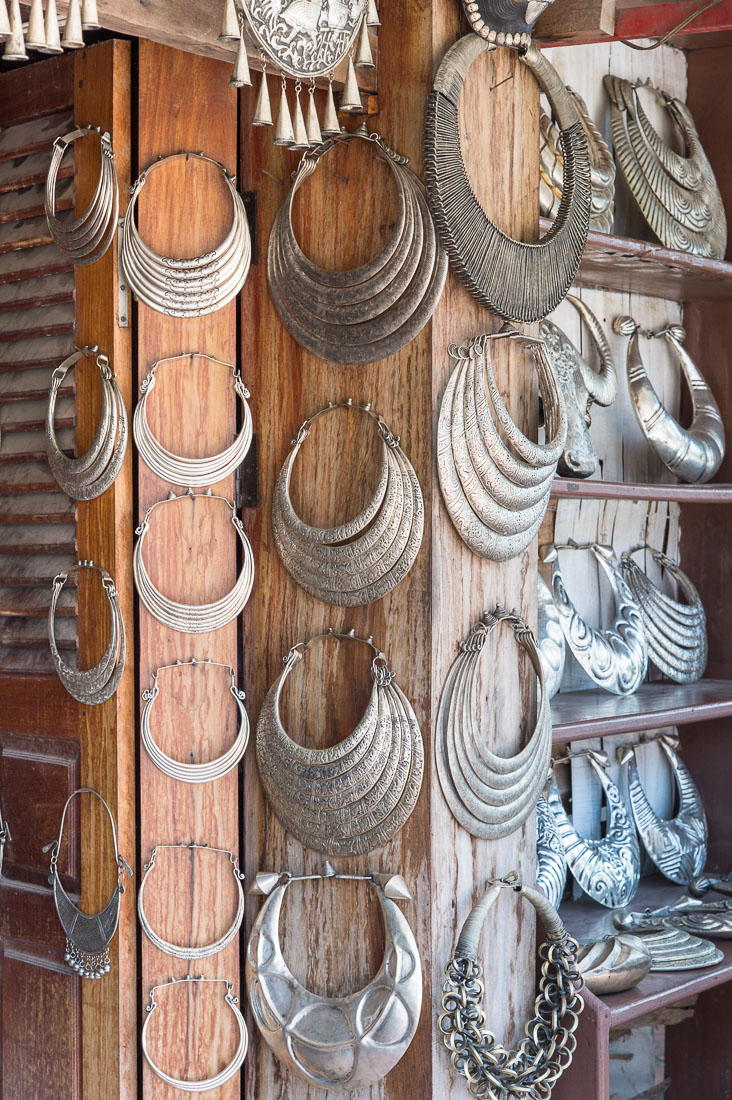 Store in Luang Prabang offering handcrafted silver neckrings normally worn by people from ethnic minorities. Lao PDR, Indochina, South East Asia.