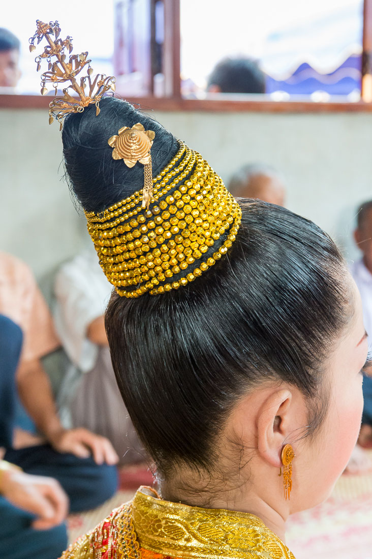 The bride showing an elaborated traditional Lao hairdo of the The bride, during the wedding cerimony, Ving Keo Ban, Sainyabuli province. Lao PDR, Laos, Indochina, South East Asia