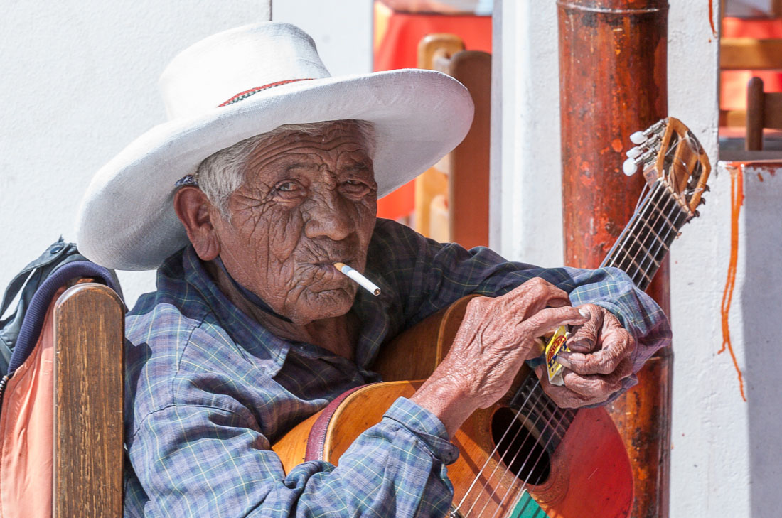 Old man playing guitar, Paracas, Peru, South America