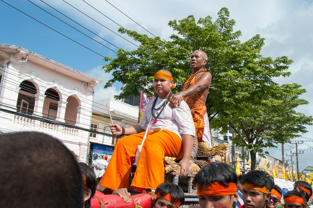 Psychic mediums followers of the Bang New Shrine on a palanquin, taking part in a street procession during the annual Chinese vegetarian festival. Phuket, Kingdom of Thailand, Indochina, South East Asia