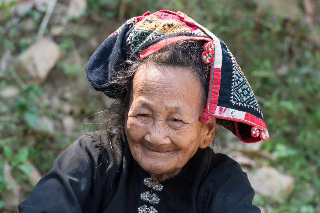 An old woman from the White Tai people ethnic minority, wearing traditional costume, Phú Yên province. Viet Nam, Indochina, South East Asia.