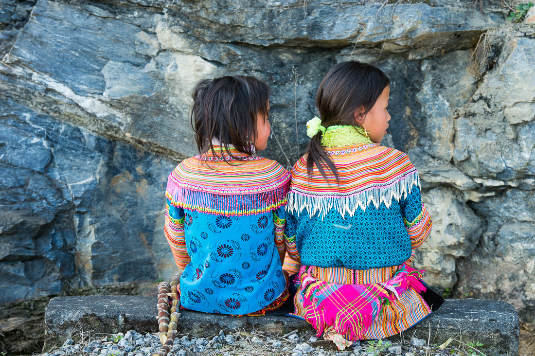 Little girls from the Red Hmong people ethnic minority, wearing traditional costume, countryside Ha Giang province. Viet Nam, Indochina, South East Asia.