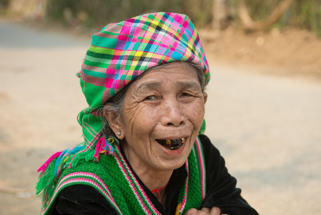 Old woman from the Black Hmong people ethnic minority, showing her blackened teeth, wearing traditional costume, countryside Lai Chau province. Viet Nam, Indochina, South East Asia.