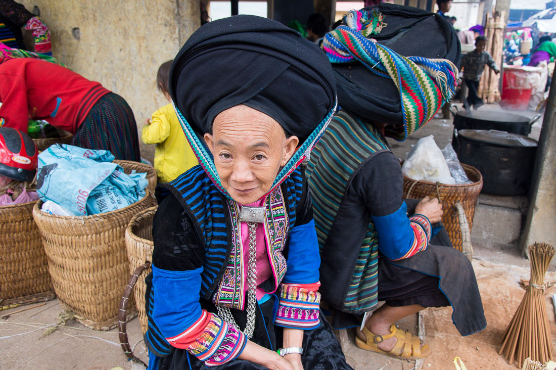 Woman from the Dao people ethnic minority group, wearing turban hat and traditional clothes. Lung Phin market, Ha Gang province, Viet Nam, Indonesia, South East Asia