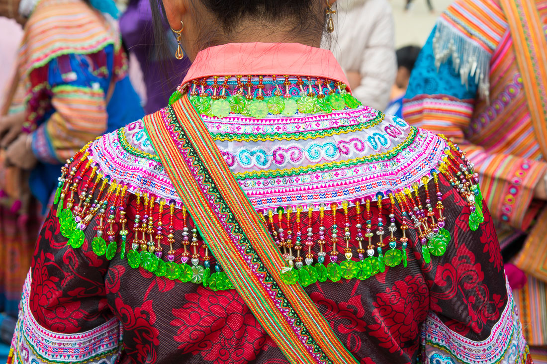 Particular from the costume of the Flower Hmong people ethnic minority, Bac Ha market, Lao Cai province. Viet Nam, Indochina, South East Asia.