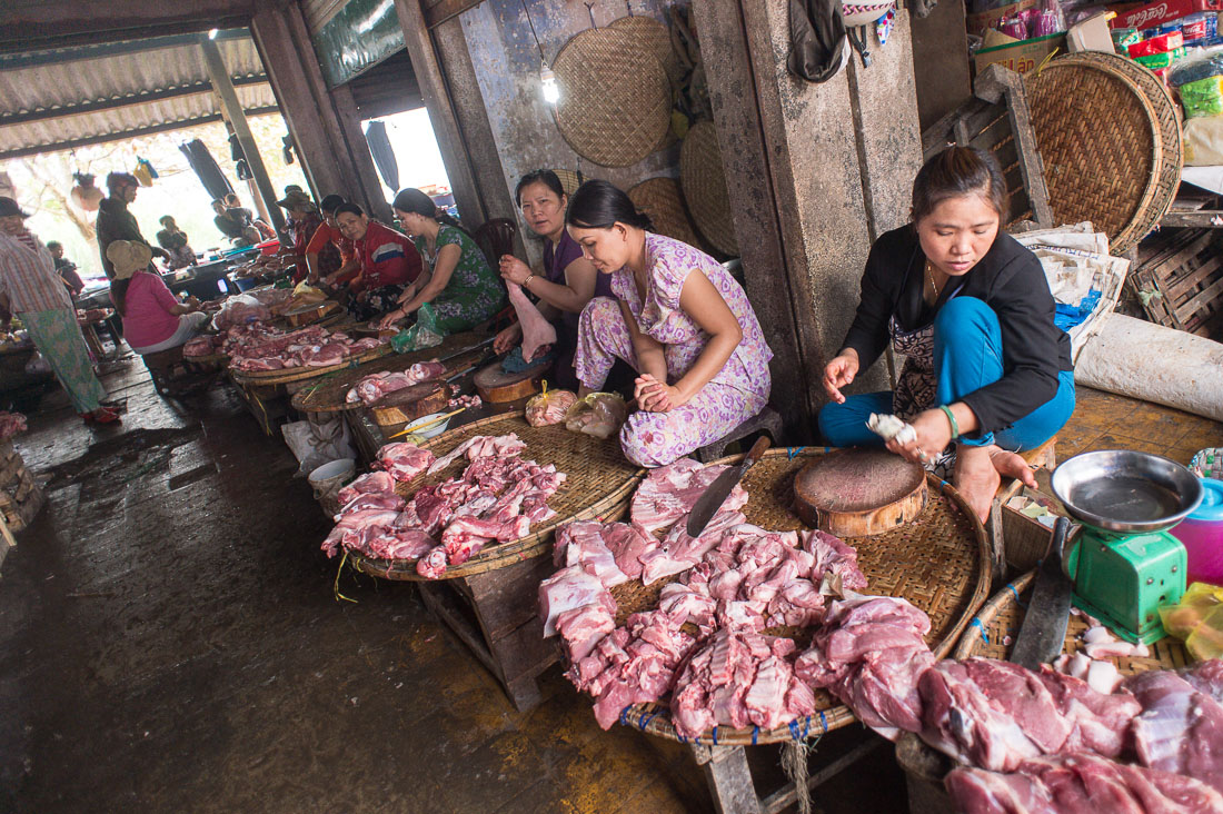 Women selling pork meat at Hue market, Thua Thien-Hue province. Viet Nam, Indochina, South East Asia.