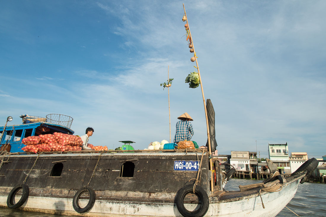 Bamboo sticks with attached fresh produce for sale at Cai Rang floating market, Mekong River Delta, Hau Giang Province, Viet Nam, Indochina, South East Asia