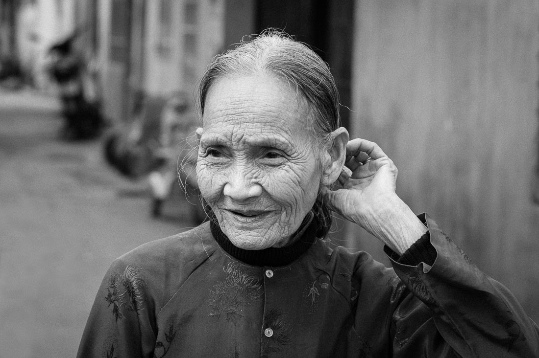 On old Vietnamese woman in the streets of Da Nang, Viet Nam, Indochina, South East Asia.