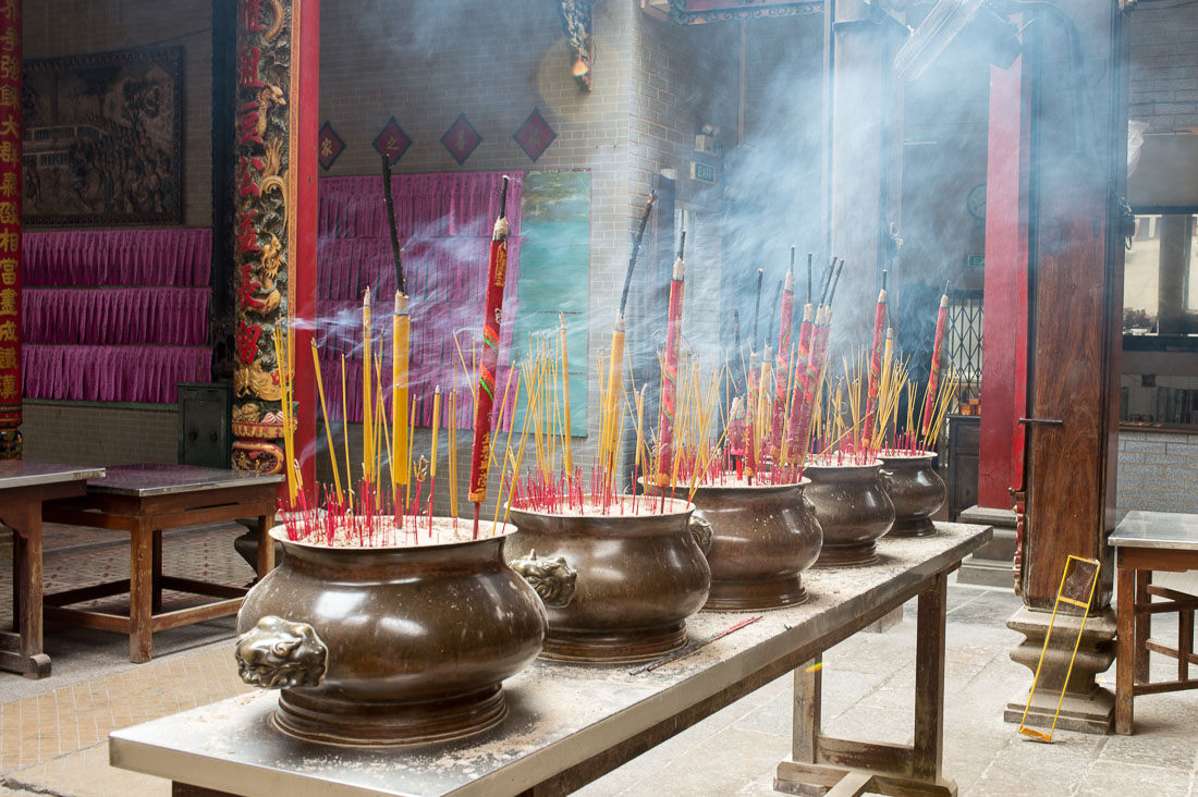 Incense burning sticks worshipping Buddha. Ho Chi Minh City (Saigon), Viet Nam, Indochina, South East Asia.