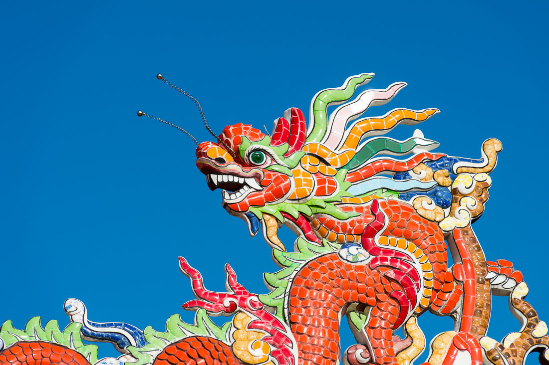 A colorful dragon on the rooftop of the Chua Buu Dai Son Buddhist padoga in Da Nang, Viet Nam, Indochina, South East Asia.