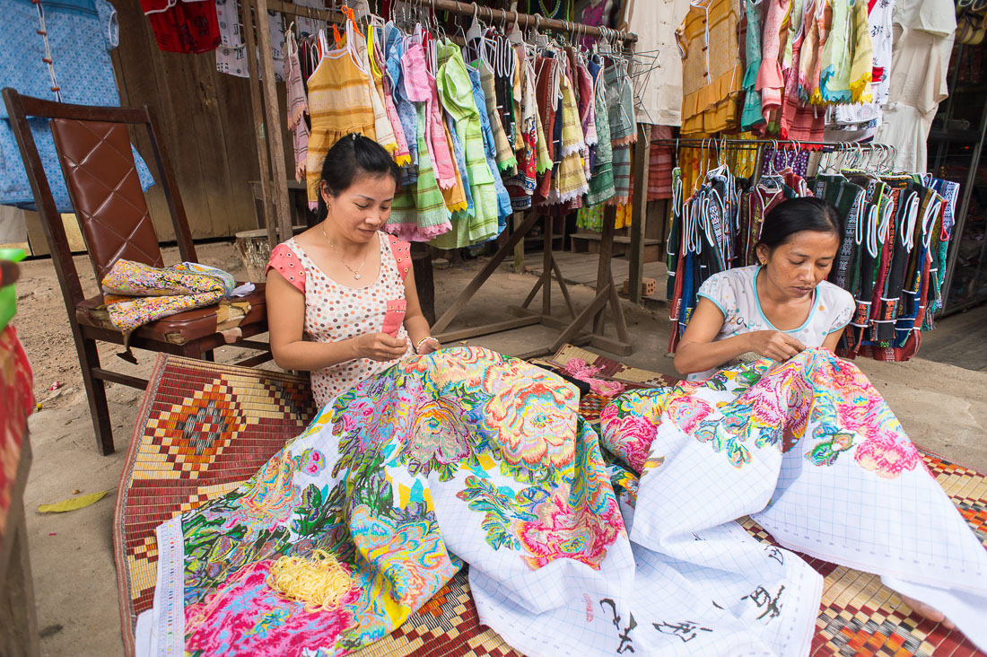 Two women working on a large embroidery, Phong Nha-Káº» BÃ ng, Quáº£ng BÃ¬nh province. Viet Nam, Indochina, South East Asia.